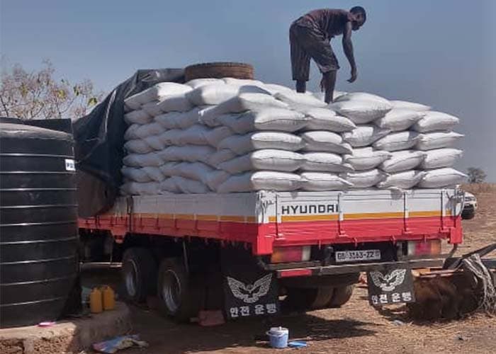 A fully loaded distribution truck ready to depart